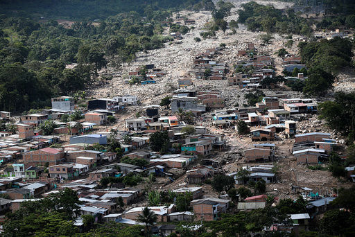 Aerial view of a neighborhood destroyed after flooding and mudslides caused by heavy rains leading several rivers to overflow, pushing sediment and rocks into buildings and roads, in Mocoa