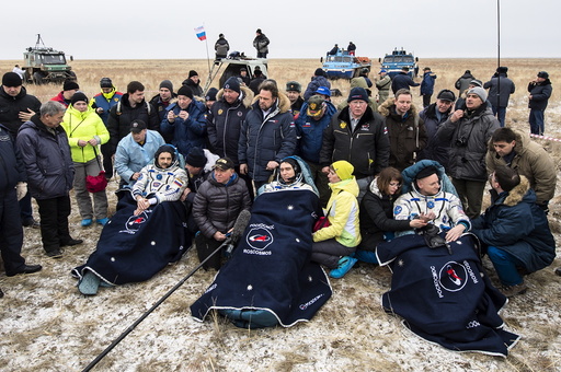 U.S. astronaut Kelly and Russian cosmonauts Volkov and Korniyenko rest after landing near Dzhezkazgan