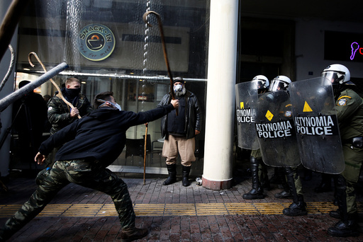 Farmers from the island of Crete clash with riot police during a demonstration outside the Agriculture Ministry in Athens