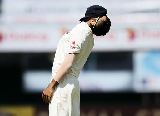 India's captain Kohli reacts after his teammate Rahul missed a catch hit by Sri Lanka's captain Mathews during the third day of their second test cricket match in Colombo