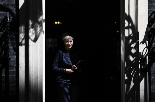 Britain's Prime Minister Theresa May prepares to speak to the media outside 10 Downing Street, in central London