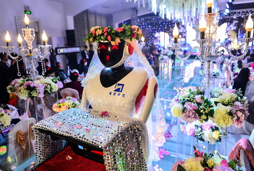 A robot dressed up as a bridesmaid serves at a wedding in Tianjin