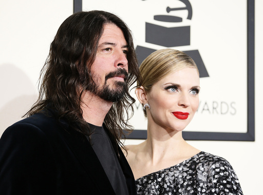 Dave Grohl and his wife Jordyn arrive at the 58th Grammy Awards in Los Angeles