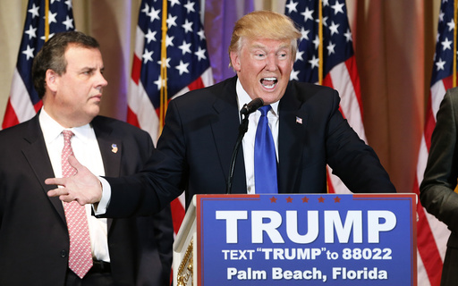 Republican U.S. presidential candidate Trump with former rival candidate Christie at his side speaks about the results of Super Tuesday primary and caucus voting during a news conference in Palm Beach