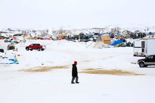 A man walks through the Dakota Access Pipeline protest camp on the edge of the Standing Rock Sioux Reservation near Cannon Ball