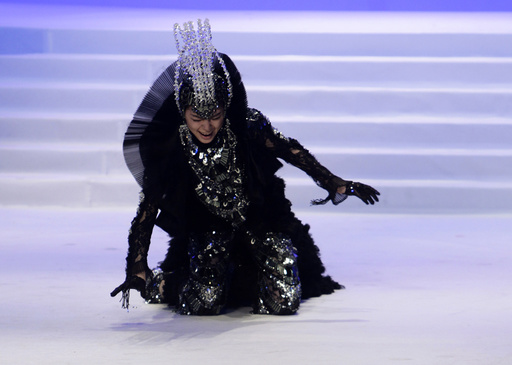 A model falls while presenting a creation during China Fashion Week in Beijing