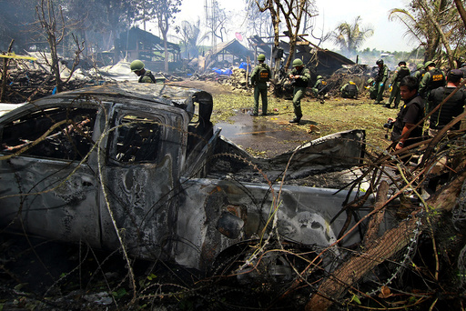Thai EOD personnel inspect the site of a bomb attack where police officers were injured, at Nong Chik district in the troubled southern province of Pattani