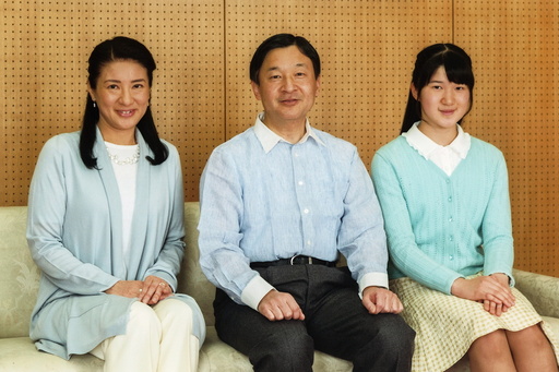 Japan's Crown Prince Naruhito poses for a photo with Crown Princess Masako and their daughter Princess Aiko at Togu Palace in Tokyo
