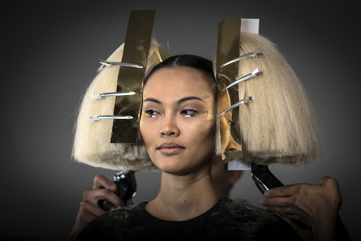 A model has her hair done before The Blonds Spring/Summer 2016 collection during New York Fashion Week