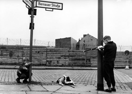 Children play in front of Berlin Wall in Bernauer Street