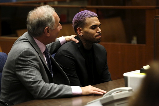 Singer Brown appears in court with his lawyer Mark Geragos for a progress hearing in Los Angeles, California