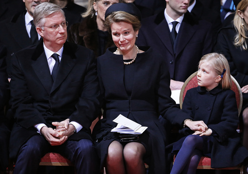 Belgium's Queen Mathilde cries while sitting besides King Philippe during a funeral service for Belgium's Queen Fabiola at Saint-Gudule cathedral in Brussels