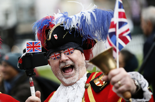 A Royal fan dressed as a Town Crier gathers to celebrate Queen Elizabeth's 90th birthday in Windsor