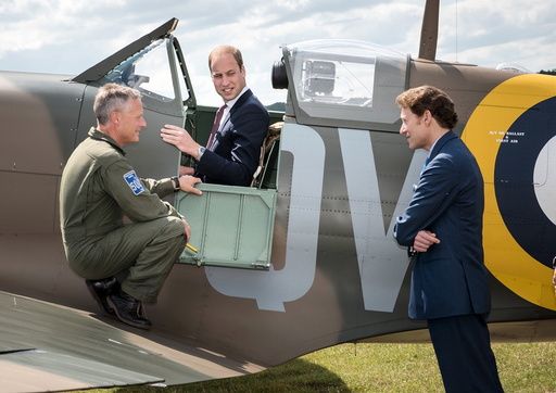 Pilot Romain and philanthropist Kaplan speak to Britain's Prince William during his visit to the Imperial War Museum in Duxford