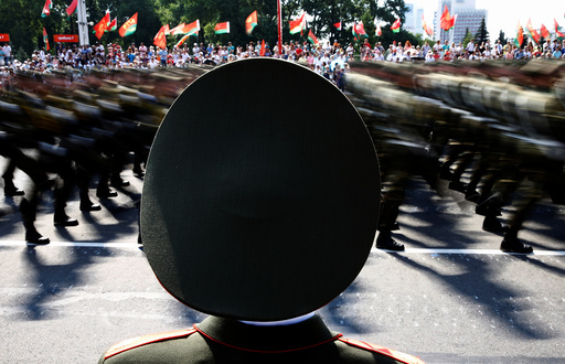 Belarussian guard of honour stands as he takes part in a military parade during celebrations marking Independence Day in Minsk