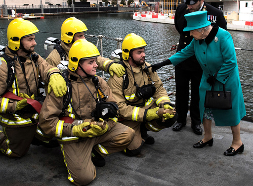 Britain's Queen Elizabeth II visits HMS Sutherland in the West India Dock, London