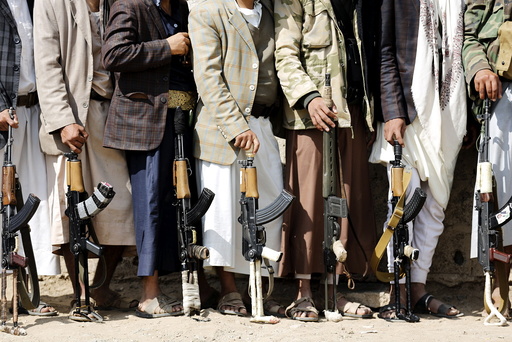 Tribesmen loyal to the Houthi movement hold their weapons at a gathering to show their support for the group, in Yemen's capital Sanaa