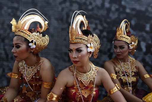 Participants from Indonesia wait to perform a dance during the last day of World Culture Festival on the banks of the river Yamuna in New Delhi