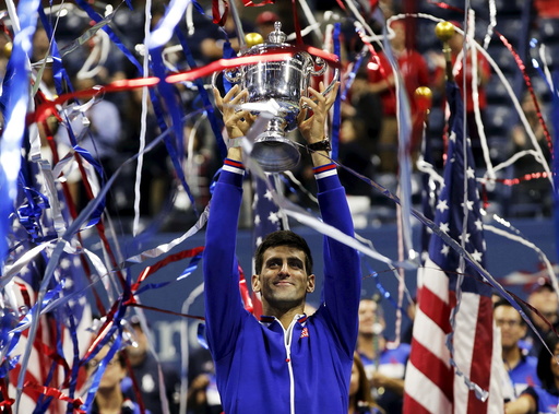 Djokovic of Serbia holds up the U.S. Open trophy after defeating Federer of Switzerland in their men's singles final match at the U.S. Open Championships tennis tournament in New York