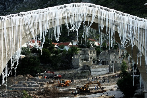 Workers prepare Mostar's oriental old town for opening ceremony of 16th century replica bridge