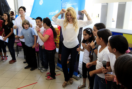 Colombian pop star and UNICEF ambassador, Shakira, dances with children from the Max Payne Hand in Hand School for Bilingual Education during her visit to the school in Jerusalem