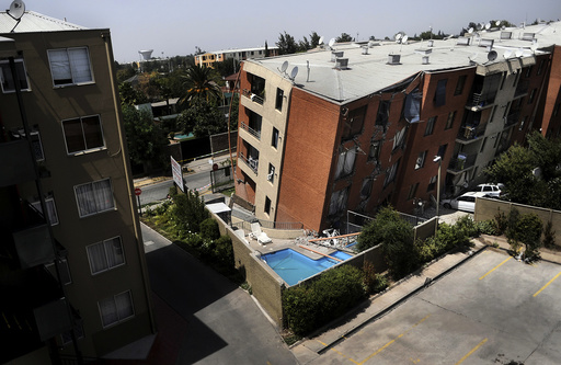 An apartment block leans over after an earthquake in Santiago