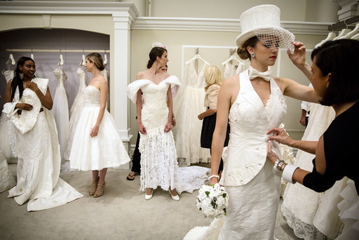 Models prepare for 11th annual toilet paper wedding dress contest at Kleinfled's Bridal Boutique in New York