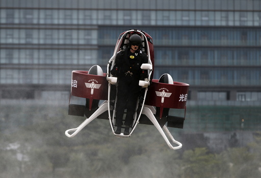 Michael Read, director of Flight Operations from New Zealand-based Martin Aircraft Company, flies a Martin Jetpack during a demonstration at a water park in Shenzhen