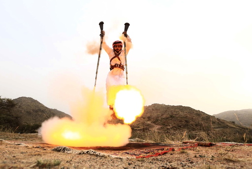 Man fires weapons as he dances during a traditional excursion near the western Saudi city of Taif