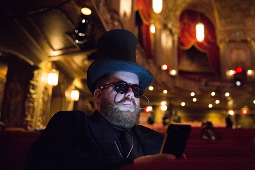 Scott Miller from Chicago takes a break while participating in the 2015 Just For Men National Beard & Moustache Championships at the Kings Theater in the Brooklyn borough of New York