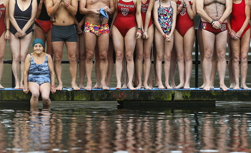 Swimmers prepare to take part in the annual Christmas Day Peter Pan Cup handicap race in the Serpentine River, in Hyde Park, London