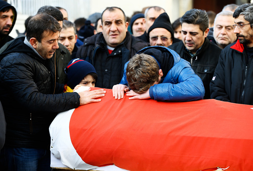 Relatives react at the funeral of Arik, a victim of an attack by a gunman at Reina nightclub, in Istanbul