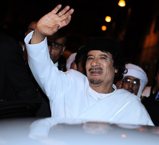 Libyan leader colonel Muammar Gaddafi walks in downtown Rome