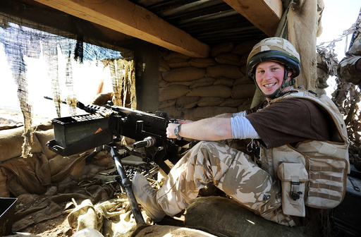 Britain's Prince Harry mans a 50 calibre machine gun, in Helmand province, southern Afghanistan