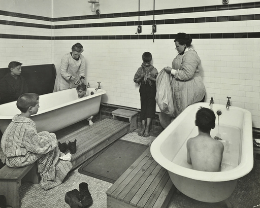 Attendants bathing boys at the Sun Court Cleansing Station, London, 1914. Artist: Unknown.