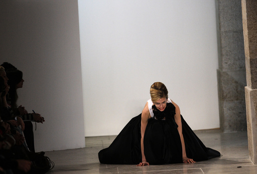 A model falls while presenting a creation by fashion designer Miguel Vieira as part of his Autumn/winter 2012 fashion collection during Lisbon Fashion Week