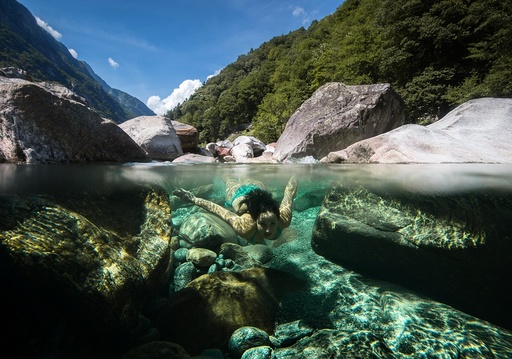 Summer bathing in Swiss Verzasca river