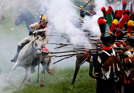 Participants reenact the 1812 Battle of Borodino between Russia and the invading French army during anniversary celebrations in Moscow region