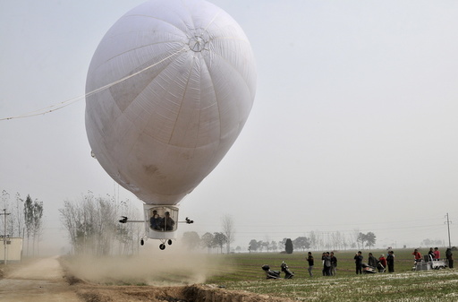 A home-made airship, made by 29-year-old local man Shi Songbo, lifts off during a test flight next to crop fields in Ningling county of Shangqiu