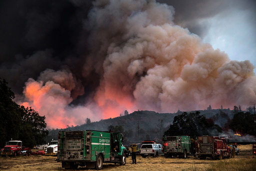 Firefighters watch the Rocky Fire advance in Lake County, California