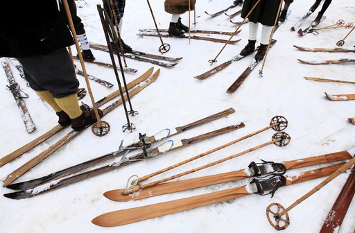Participants on vintage skis prepare for a traditional historical ski race in the northern Bohemian town of Smrzovka