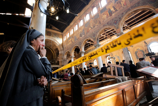 A nun cries as she stands at the scene inside Cairo's Coptic cathedral, following a bombing, in Egypt