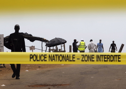 A police cordon is seen while Ivorian police prepare to inspect the area of the hotel Etoile du Sud following an attack by gunmen from al Qaeda's North African branch, in Grand Bassam