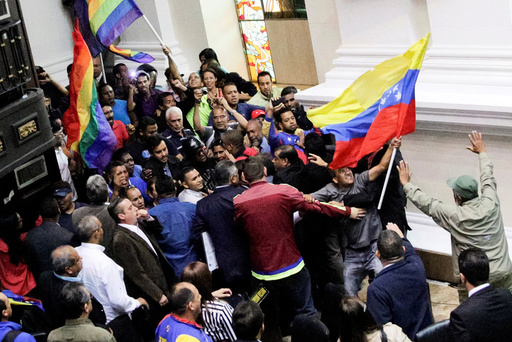 Supporters of Venezuela's President Nicolas Maduro storm into a session of the National Assembly in Caracas