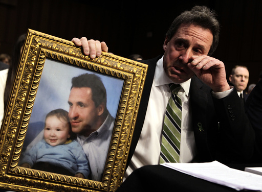 Neil Heslin, father of 6-year-old Newtown victim Jesse Lewis, cries during Senate Judiciary Committee hearing on Assault Weapons Ban of 2013 in Washington