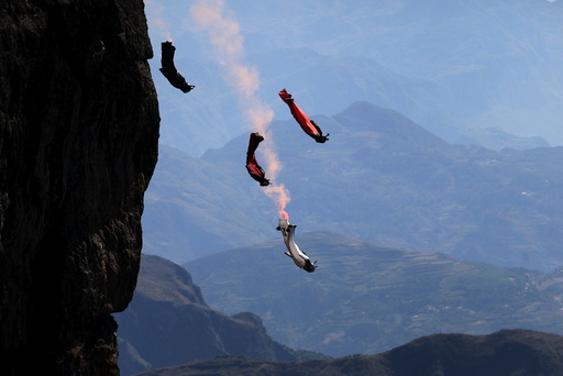 Wingsuit flyer contestants practice ahead of a competition in Zhaotong