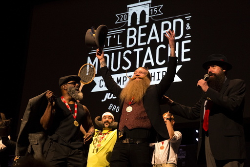 Scott Metts from Orlando, Florida, celebrates after winning the 2015 Just For Men National Beard & Moustache Championships at the Kings Theater in the Brooklyn borough of New York