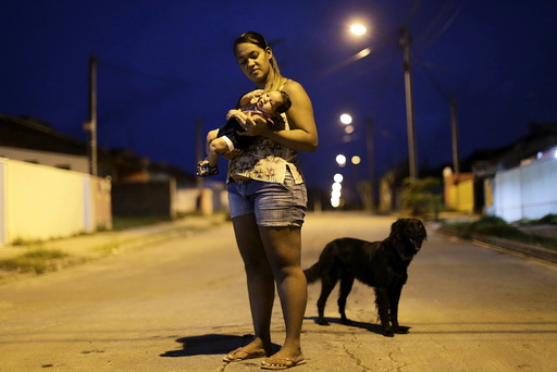 Germana Soares holds her son Guilherme Soares Amorim, who was born with microcephaly, near at her house in Ipojuca