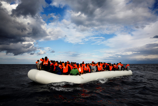 An overcrowded raft drifts out of control in the central Mediterranean Sea