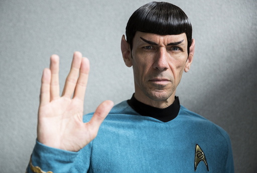 An impersonator poses in costume as the character Mr Spock from the science fiction series 
